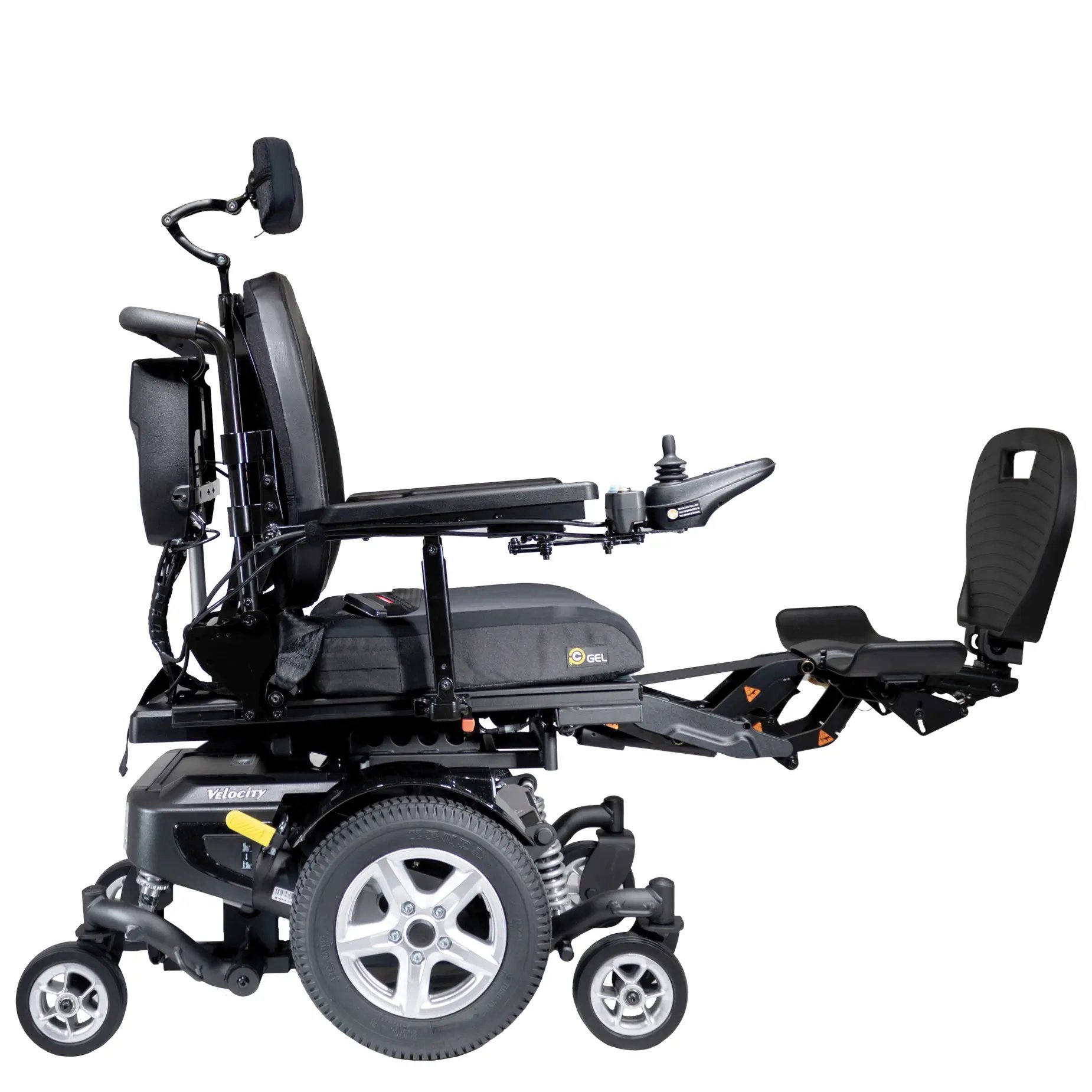 The Merits power wheelchair Velocity right profile with legs extended view.