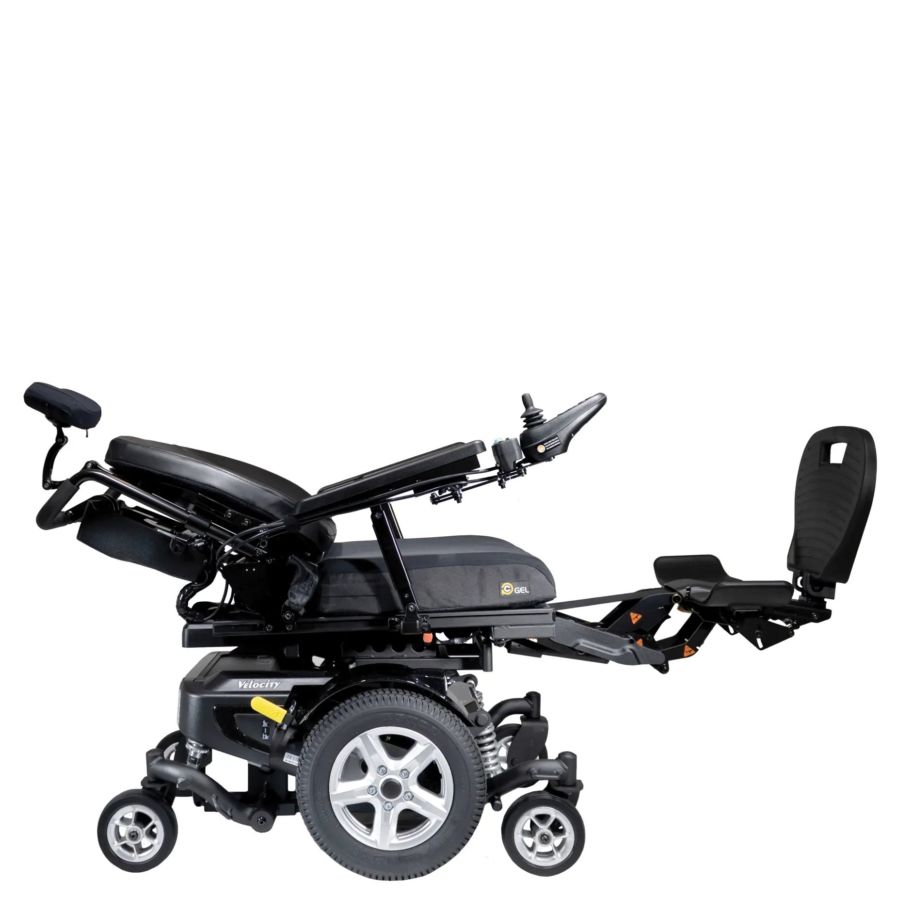 The Merits power wheelchair Velocity right profile reclined with legs extended view.