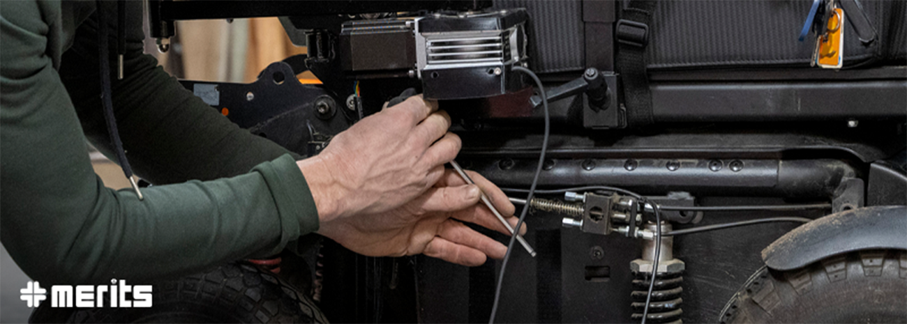 Technician working on power wheelchair